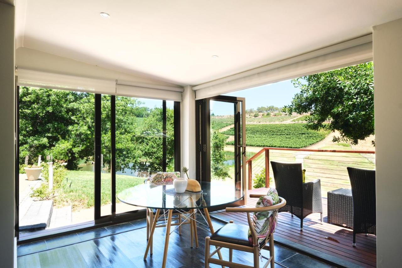 Alluvia Boutique Winery & Luxury Accommodation Stellenbosch Eksteriør billede A room with a view of the vineyards